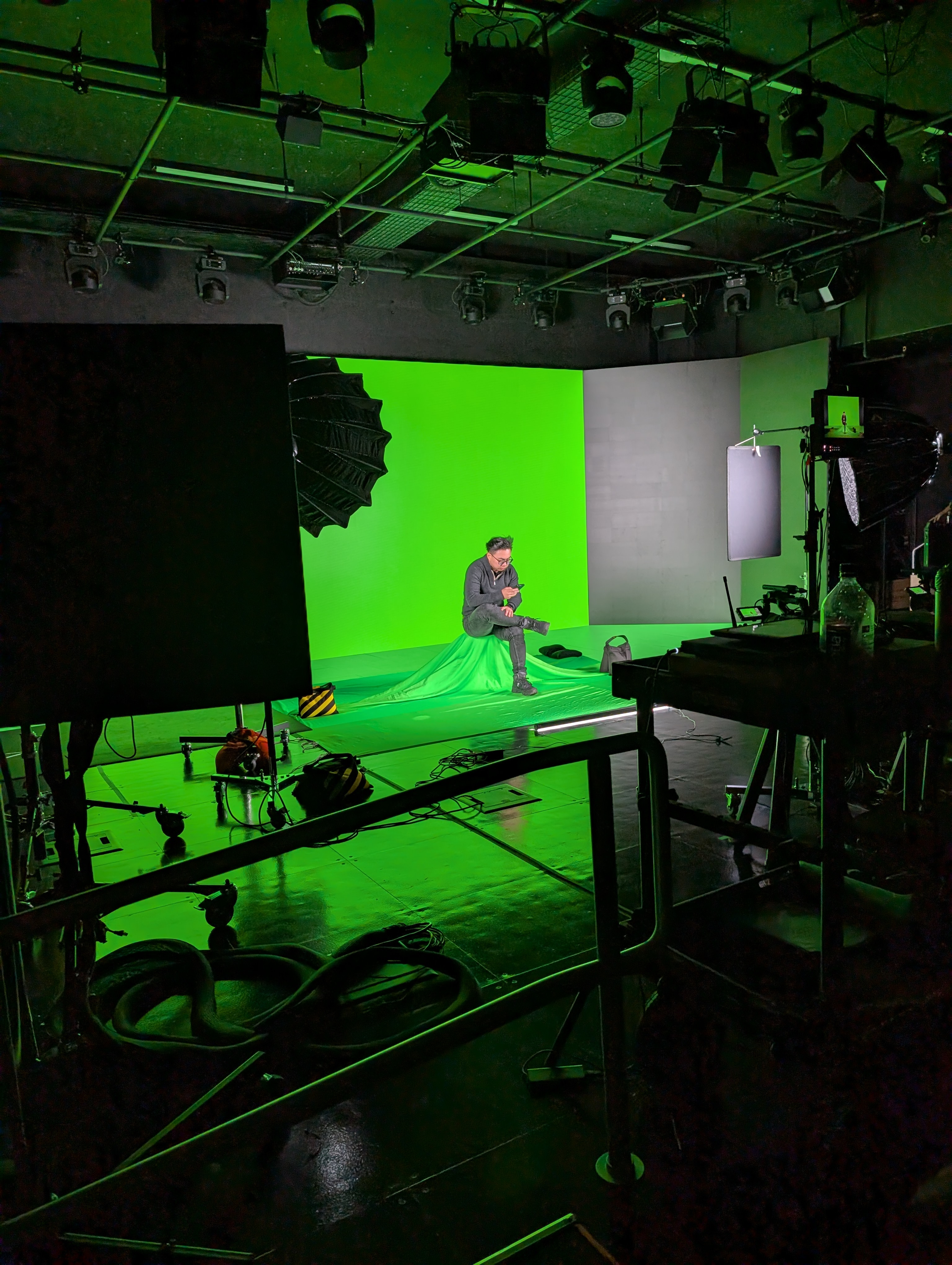 Audience member being filmed on the green screen XR Stage